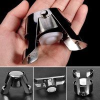 Metal sparkling wine stopper with a locking clamp